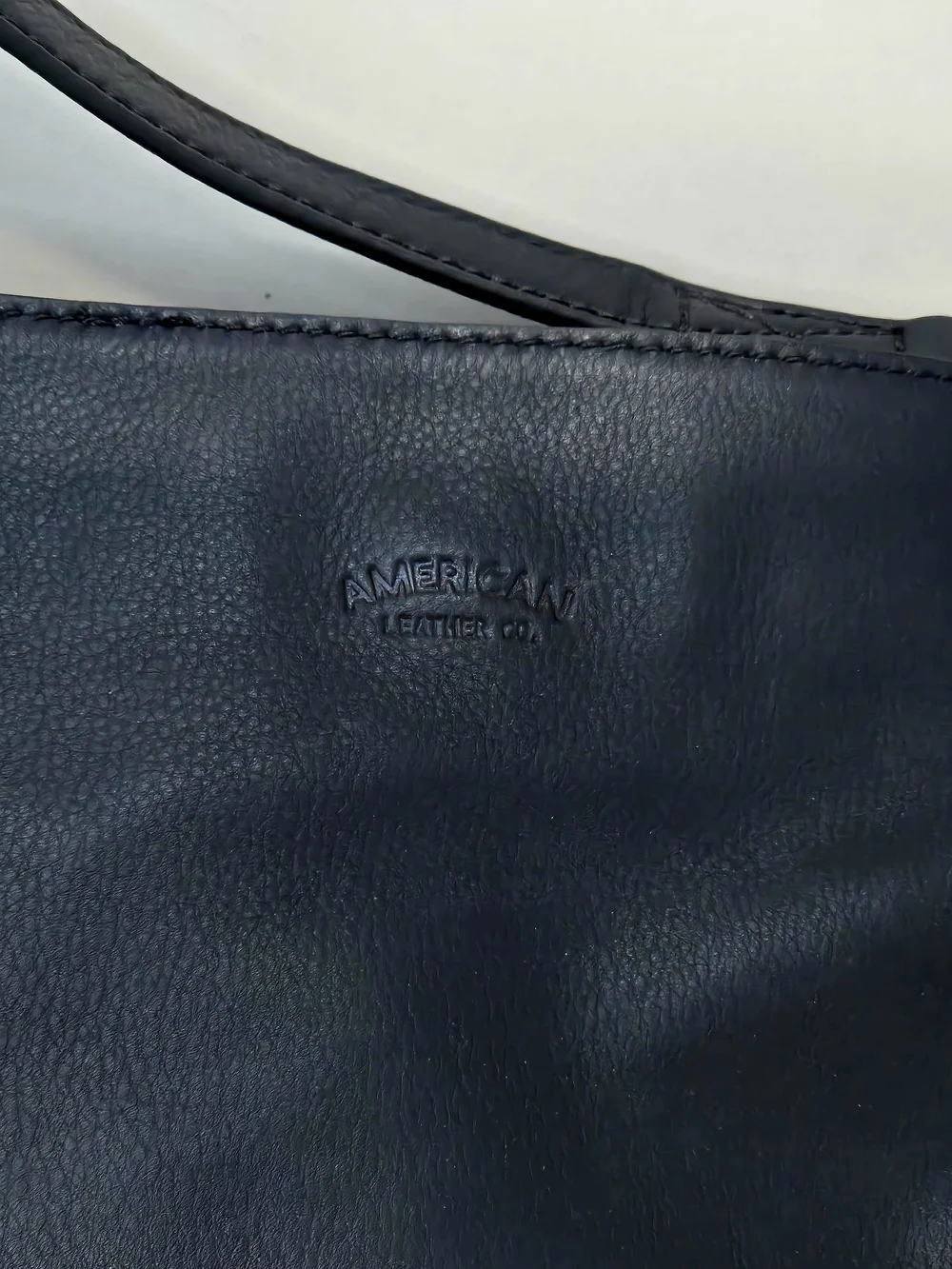 Elegant Black Leather Shoulder Bag with Gold Stud Details